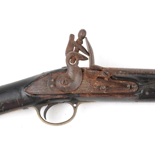 2553 - An 19th century Tower British military flintlock rifle, impressed proof marks, 138cm in length