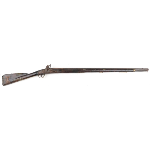 2552 - A 19th century Tower British military flintlock rifle with brass mounts, impressed proof marks, 144c... 