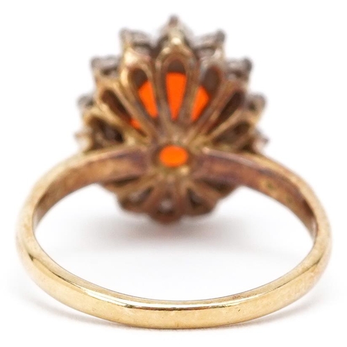 3077 - A continental gold orange stone and diamond cluster ring, the orange stone 9.80mm x 8.70mm, each dia... 