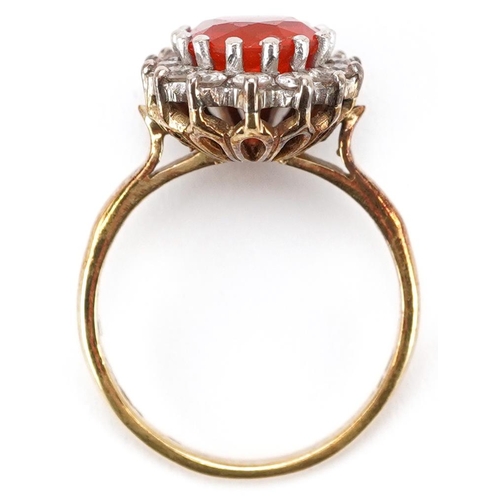 3077 - A continental gold orange stone and diamond cluster ring, the orange stone 9.80mm x 8.70mm, each dia... 