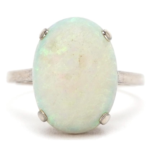 3075 - A 9ct white gold cabochon opal ring, the opal approximately 15.0mm x 11.0mm x 5.34mm deep, size L, 3... 