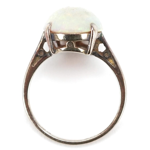 3075 - A 9ct white gold cabochon opal ring, the opal approximately 15.0mm x 11.0mm x 5.34mm deep, size L, 3... 