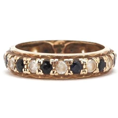 3345 - A 9ct gold sapphire and clear stone eternity ring, size P, 2.7g.