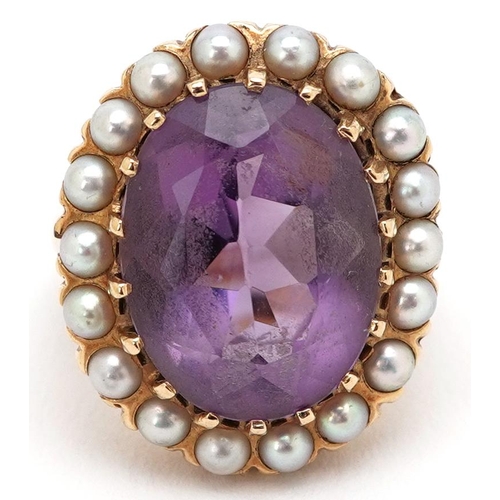 3014 - A large continental gold amethyst and cultured pearl ring, the ring head 23.10mm x 19.40mm, size J, ... 