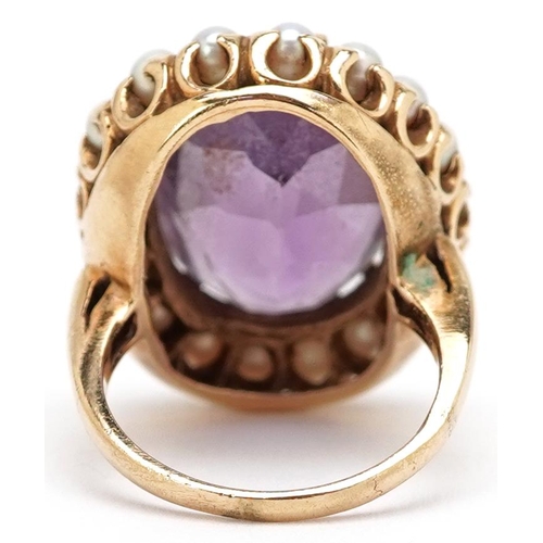 3014 - A large continental gold amethyst and cultured pearl ring, the ring head 23.10mm x 19.40mm, size J, ... 