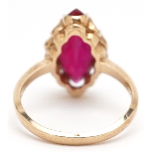  A continental 10ct gold marquis cut ruby ring, the ruby approximately 14.60mm x 6.90mm x 4.40mm deep... 