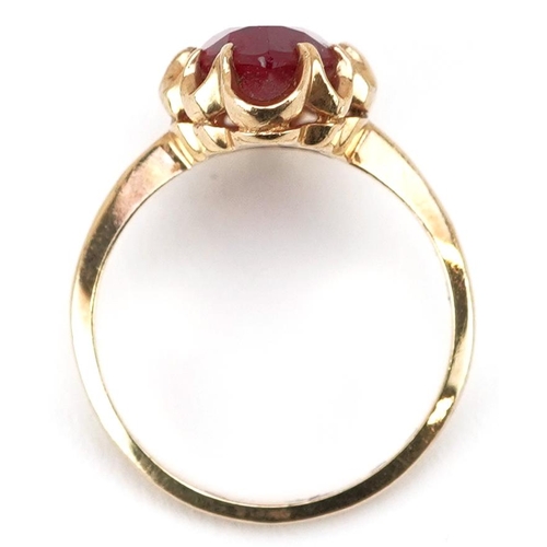  A continental 10ct gold marquis cut ruby ring, the ruby approximately 14.60mm x 6.90mm x 4.40mm deep... 