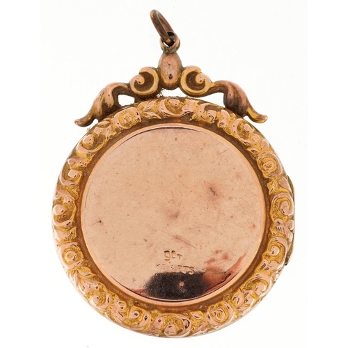 3207 - A large Victorian 9ct gold back and front locket set with a garnet and seed pearls, 4.4cm high, 12.5... 