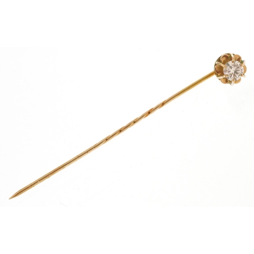 3133 - An unmarked gold diamond solitaire stickpin, the diamond approximately 3.50mm in diameter, 1.0g.