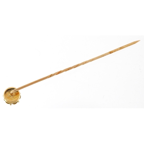 3133 - An unmarked gold diamond solitaire stickpin, the diamond approximately 3.50mm in diameter, 1.0g.