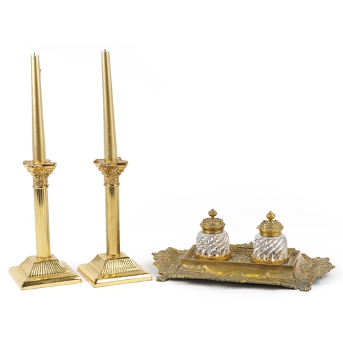 163 - A mid 20th century George III style brass desk stand fitted with two glass inkwells, with scrollwork... 