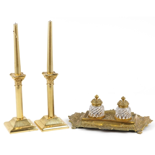 163 - A mid 20th century George III style brass desk stand fitted with two glass inkwells, with scrollwork... 