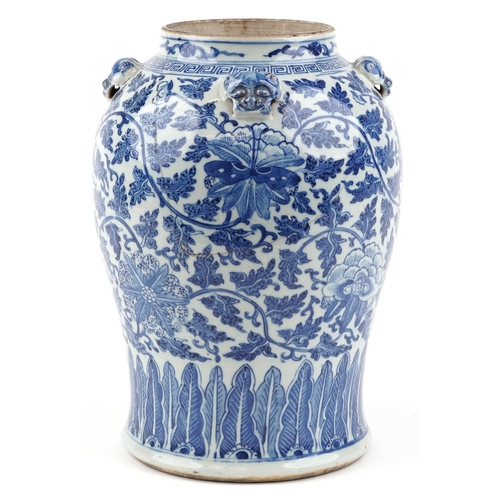  A Chinese blue and white porcelain jar, late 19th/early 20th century, decorated with flower heads an... 