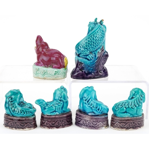 373 - A group of five Chinese turquoise glazed porcelain miniature Foo dogs, 20th century, together with a... 