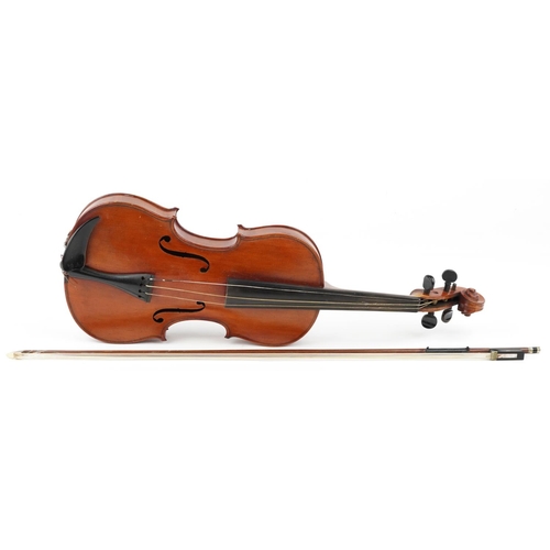 1040 - A 20th century violin, the length of back excluding button 35.5cm, with a bow, cased.