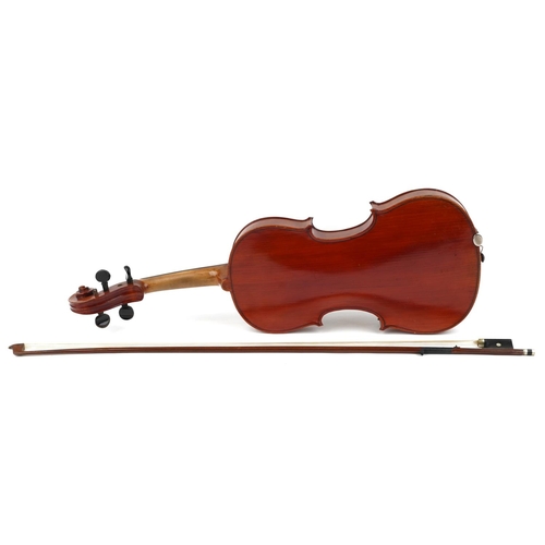 1040 - A 20th century violin, the length of back excluding button 35.5cm, with a bow, cased.