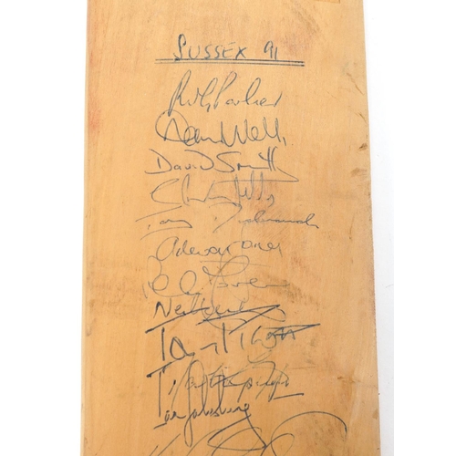 2296 - A Hunt's County cricket bat signed by The Sussex & Essex 1991 teams, 86cm in length.