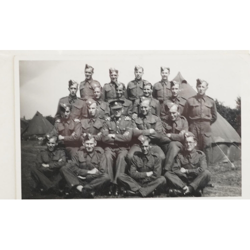 2454 - An album of military interest black and white photographic postcards including soldier on horseback,... 