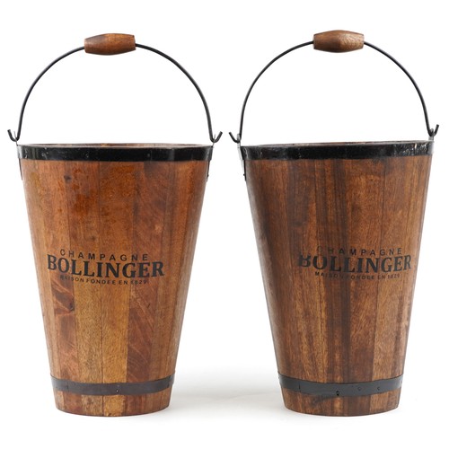 1030 - A pair of Bollinger design Champagne hardwood ice buckets with metal mounts and swing handles, 40cm ... 