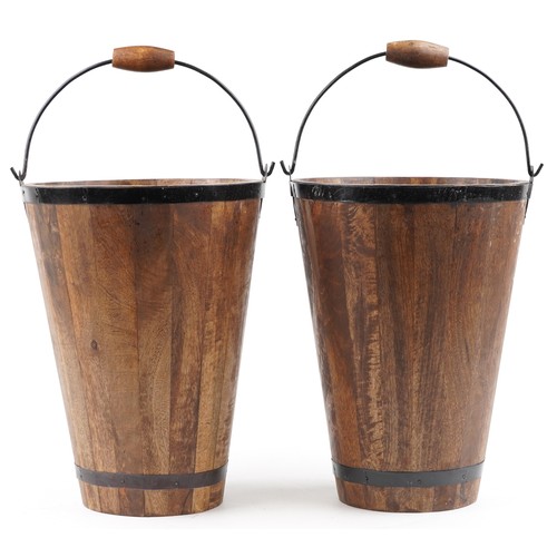 1030 - A pair of Bollinger design Champagne hardwood ice buckets with metal mounts and swing handles, 40cm ... 