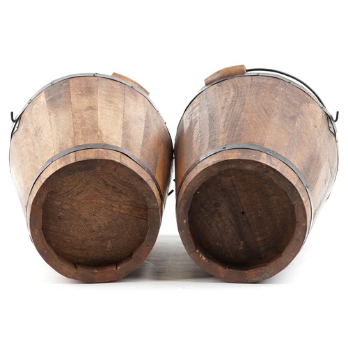 1030 - A pair of Bollinger design Champagne hardwood ice buckets with metal mounts and swing handles, 40cm ... 