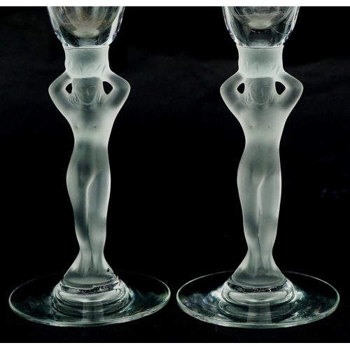 366 - A pair of mid 20th century Bayel frosted crystal Champagne flutes with figural stems, 21cm high.