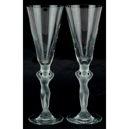 366 - A pair of mid 20th century Bayel frosted crystal Champagne flutes with figural stems, 21cm high.