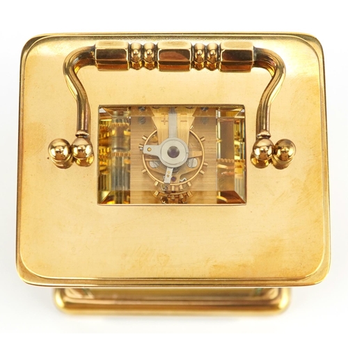 181 - A 20th century gilt brass carriage clock, the white enamelled dial with black Roman numerals, detail... 