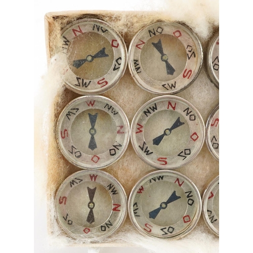 2493 - Twelve German military interest Luftwaffe escape compasses.