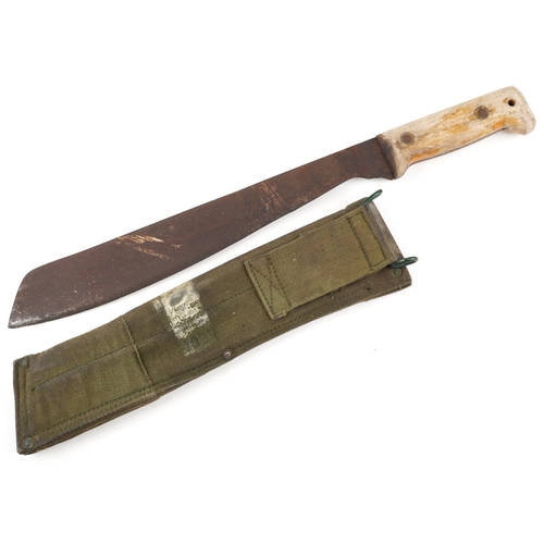 2539 - A vintage jungle machete with canvas sheath, 46cm in length.