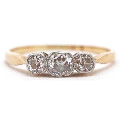 3187 - An 18ct gold diamond three stone ring, the central diamond approximately 3.80mm x 3.40mm x 2.10mm de... 