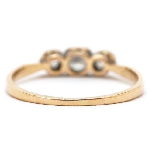 3187 - An 18ct gold diamond three stone ring, the central diamond approximately 3.80mm x 3.40mm x 2.10mm de... 