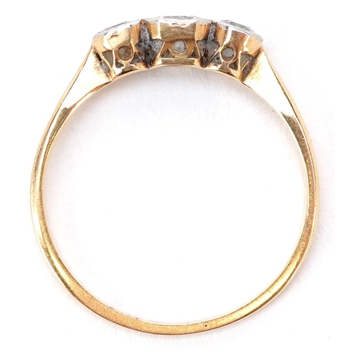 3187 - An 18ct gold diamond three stone ring, the central diamond approximately 3.80mm x 3.40mm x 2.10mm de... 