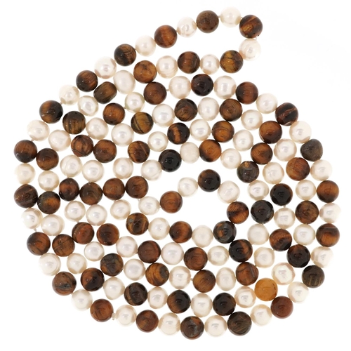 3461 - A freshwater pearl and tiger's eye bead necklace, 120cm in length, 112.8g.