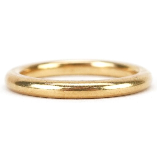 3052 - An unmarked gold wedding band, tests as 22ct gold, size N, 4.9g.