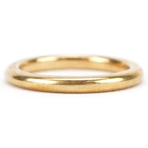 3052 - An unmarked gold wedding band, tests as 22ct gold, size N, 4.9g.