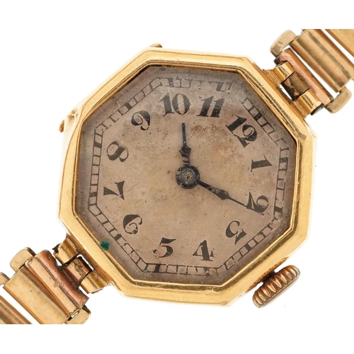 3142 - An Art Deco 18ct gold cased ladies wristwatch with hexagonal dial and gilt metal strap, 21mm wide.