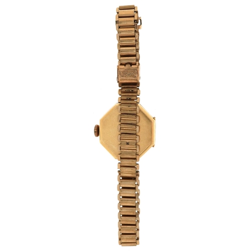 3142 - An Art Deco 18ct gold cased ladies wristwatch with hexagonal dial and gilt metal strap, 21mm wide.