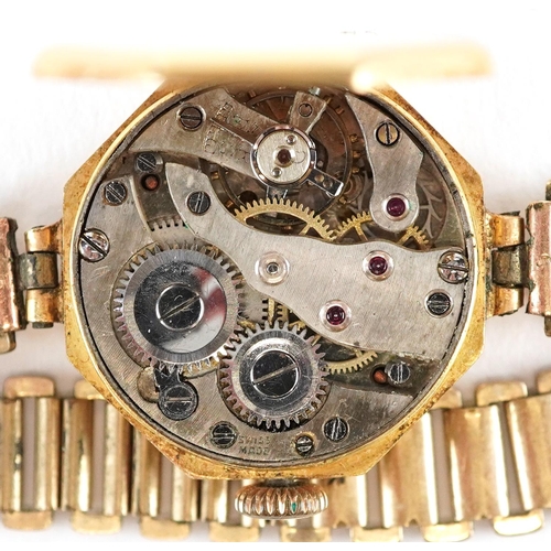 3142 - An Art Deco 18ct gold cased ladies wristwatch with hexagonal dial and gilt metal strap, 21mm wide.