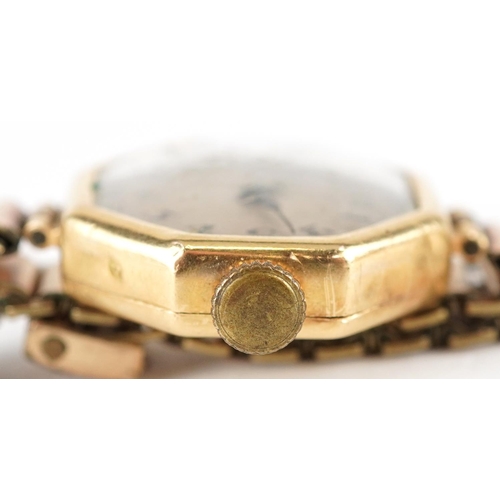 3142 - An Art Deco 18ct gold cased ladies wristwatch with hexagonal dial and gilt metal strap, 21mm wide.