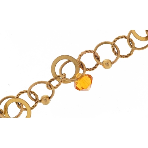 3122 - A Modernist 9ct gold bracelet with two citrine coloured drops, 18cm in length, 5.8g.