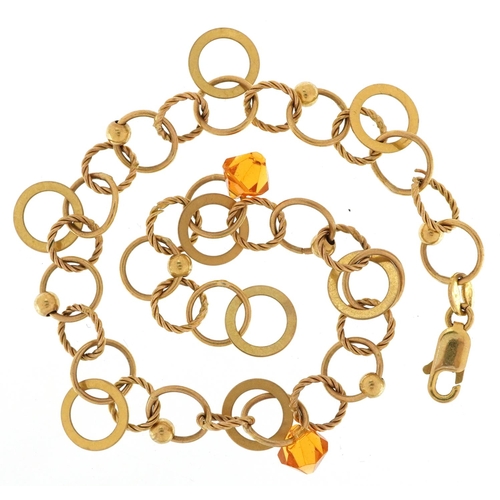 3122 - A Modernist 9ct gold bracelet with two citrine coloured drops, 18cm in length, 5.8g.