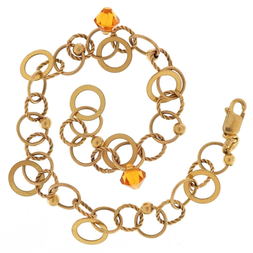 3122 - A Modernist 9ct gold bracelet with two citrine coloured drops, 18cm in length, 5.8g.