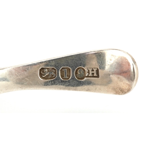 537 - A Georgian silver shell shaped caddy spoon, incomplete hallmarks, 8cm in length, 12.0g.