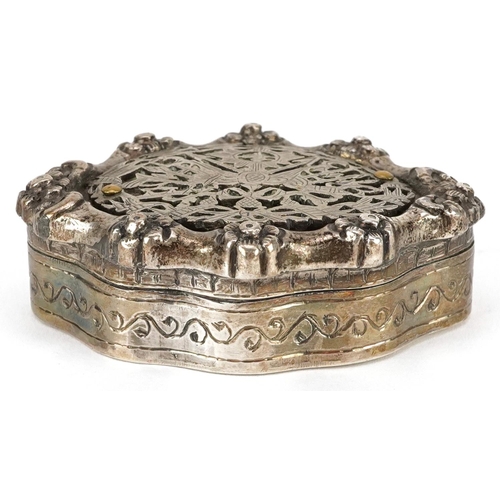 511 - A continental white metal serpentine patch box cast with flower heads, impressed marks to the interi... 