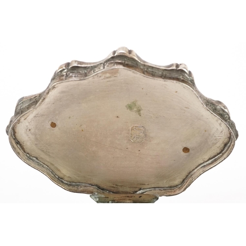 511 - A continental white metal serpentine patch box cast with flower heads, impressed marks to the interi... 