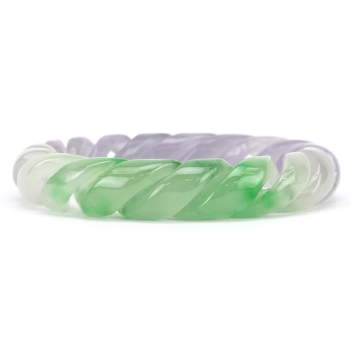 3226 - A Chinese multi coloured jade rope twist design bangle, 9cm in diameter, 90.6g.