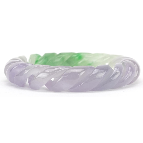 3226 - A Chinese multi coloured jade rope twist design bangle, 9cm in diameter, 90.6g.