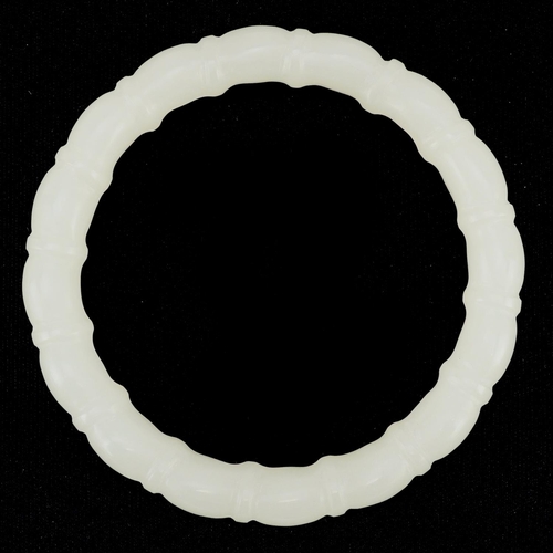 3137 - A Chinese pale green jade bamboo design bangle, 8cm in diameter, 43.0g.