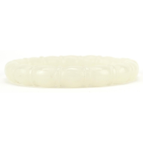 3137 - A Chinese pale green jade bamboo design bangle, 8cm in diameter, 43.0g.